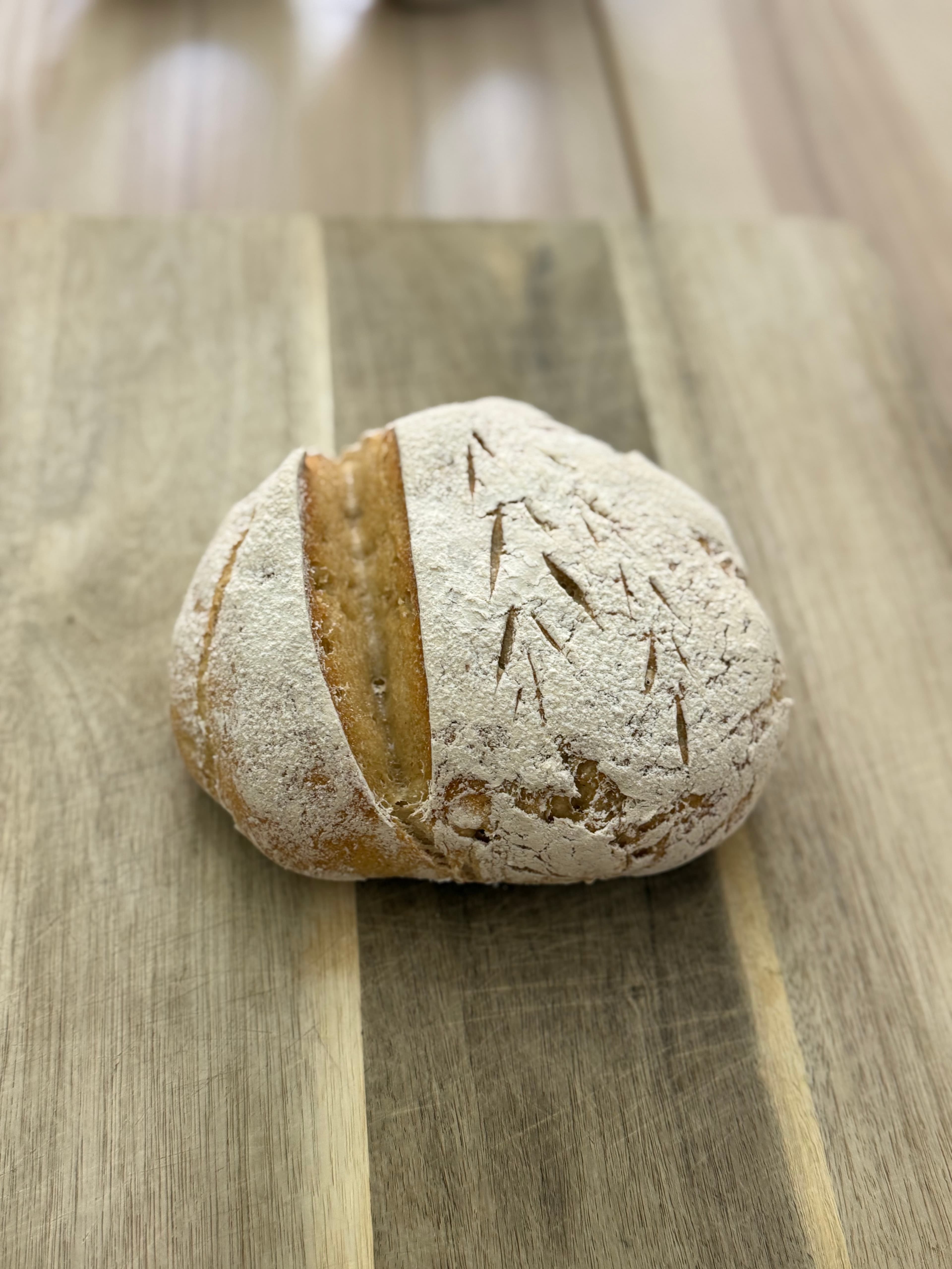 Beautifully crusty, tangy gluten-free sourdough loaf