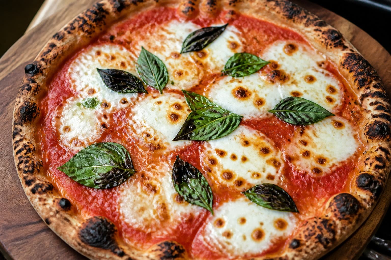 Thin crisp gluten-free sourdough pizza with leopard spotting